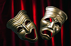 comedy_and_tragedy_masks_against_a_red_curtain
